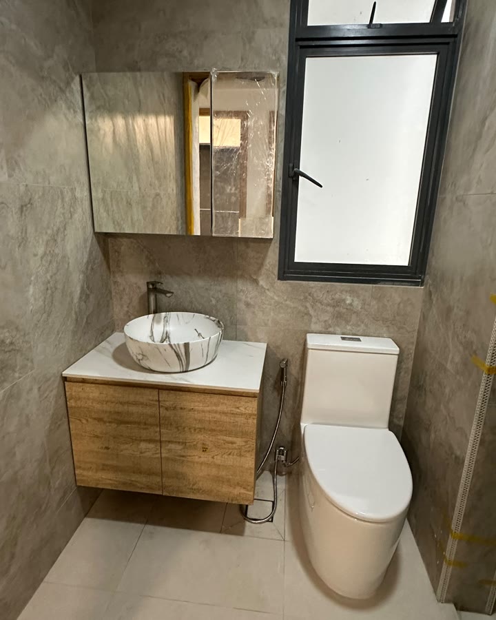 Oak vanity, marble vessel basin and one-piece WC